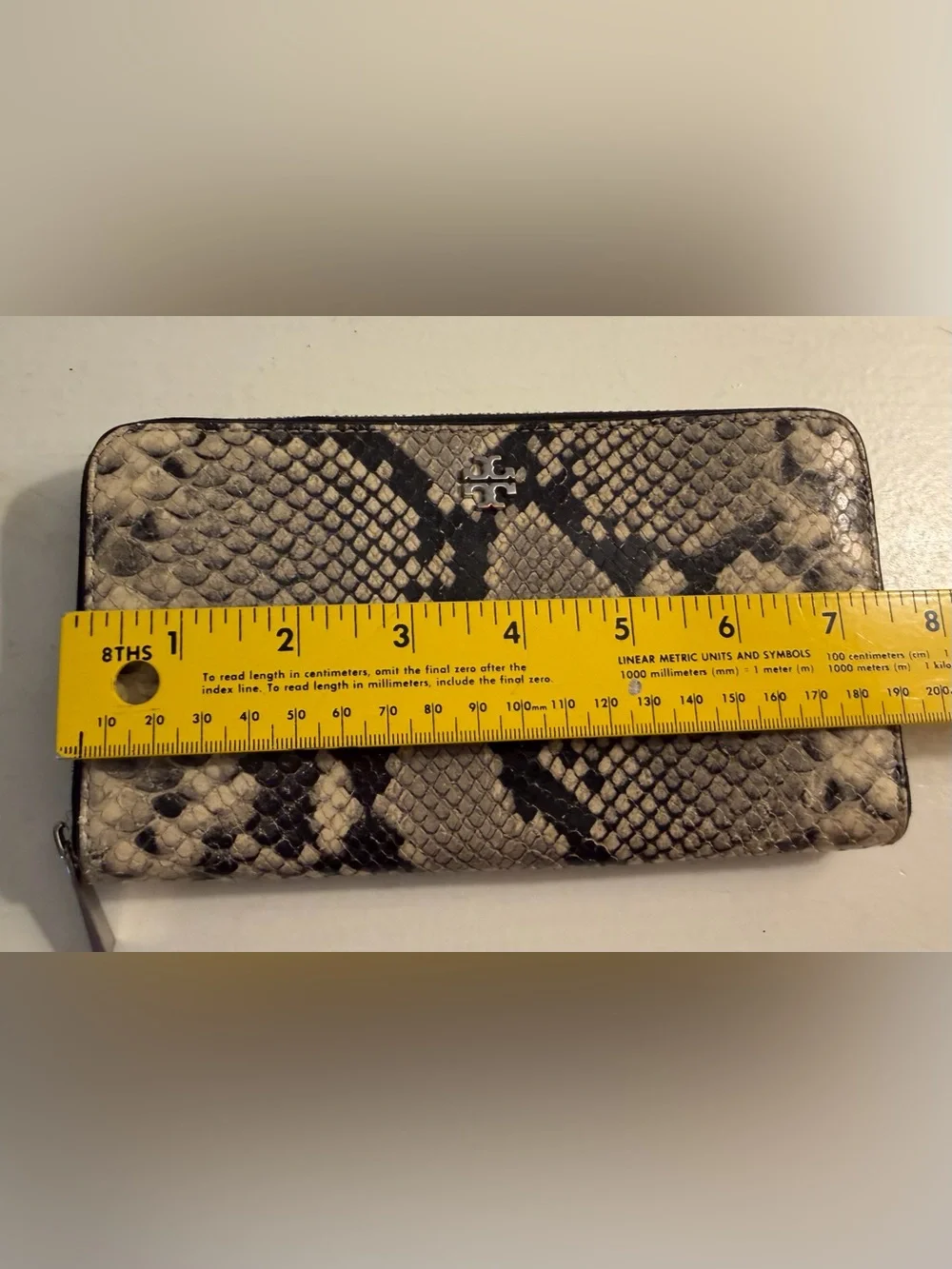 Tory Burch zip around continental wallet with snakeskin.